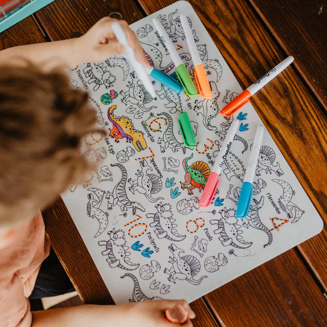 Baby boy colouring on Dinosaurs reusable silicone colouring and doodle mat