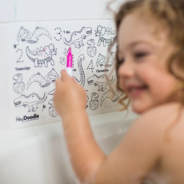 Baby boy colouring on Dinosaurs reusable silicone colouring and doodle mat