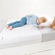 Baby boy sleeping on a Absoplus mattress protector :image,small_image,thumbnail,swatch_image