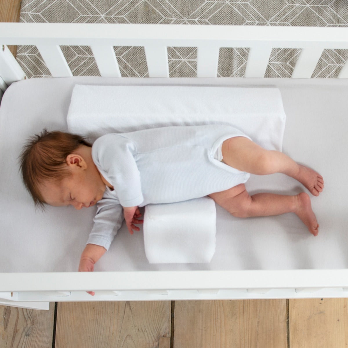 Baby sleeping with Baby positioner