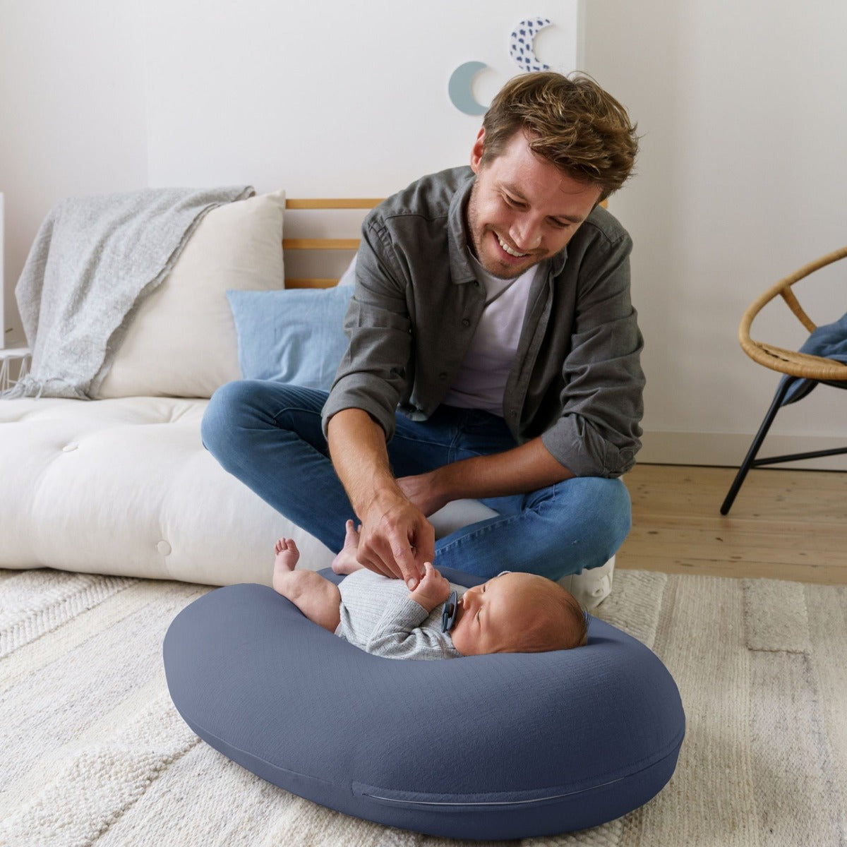 Father watching baby on Doo Moo Tetra Jersey Blue Pregnancy Pillow
