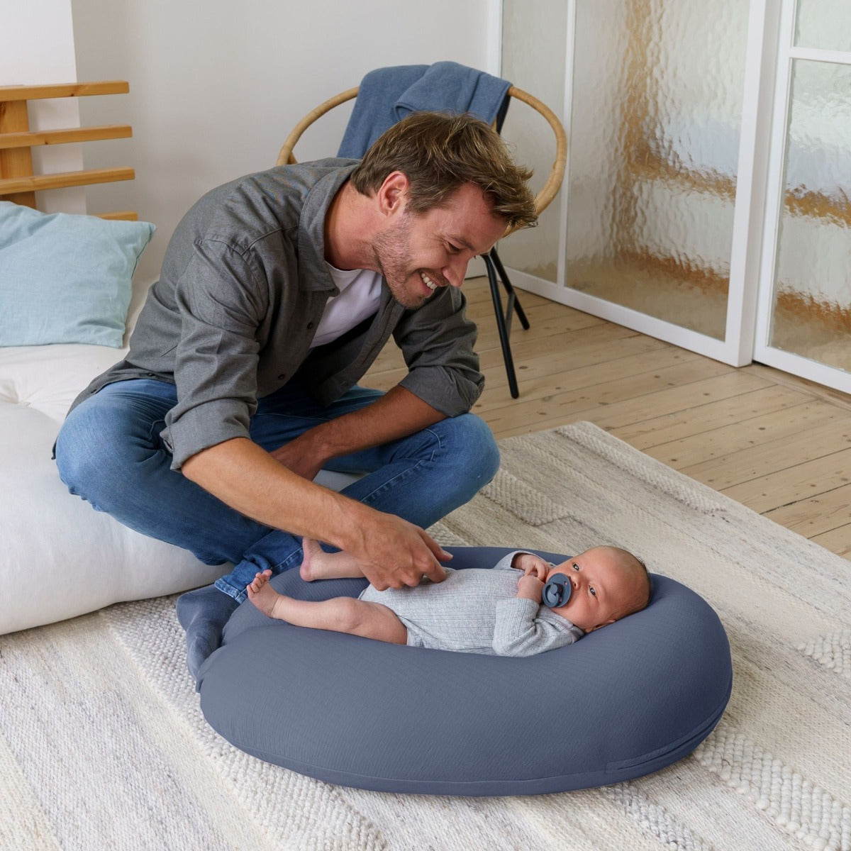 father watching baby on Doo Moo Tetra Jersey Blue Pregnancy Pillow