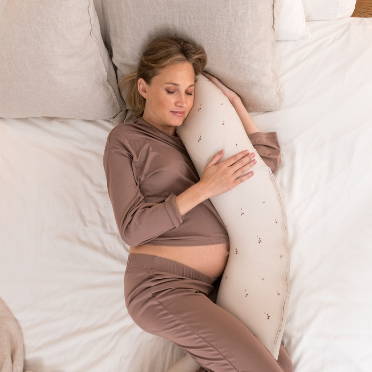 Women sleeping peacefully with Doo Moo Mushrooms Pregnancy Pillow