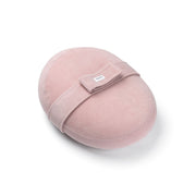 A pink-colored Doomoo Relax Cover wrapped around a maternity pillow, featuring a removable security belt.
