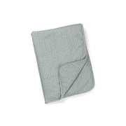 A folded green organic cotton blanket with a subtle star pattern.