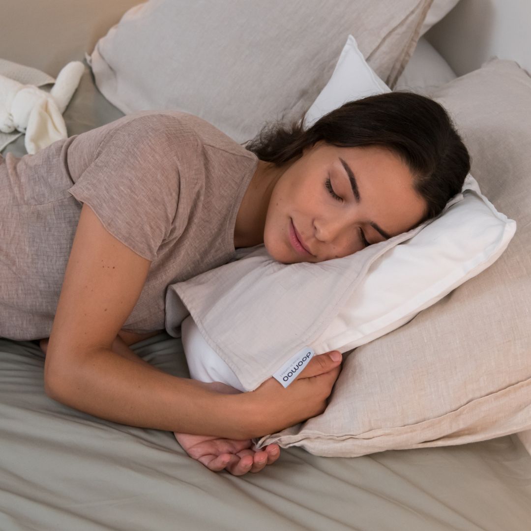 Mother sleeping with doomoo bunny detachable baby soother in almond colour