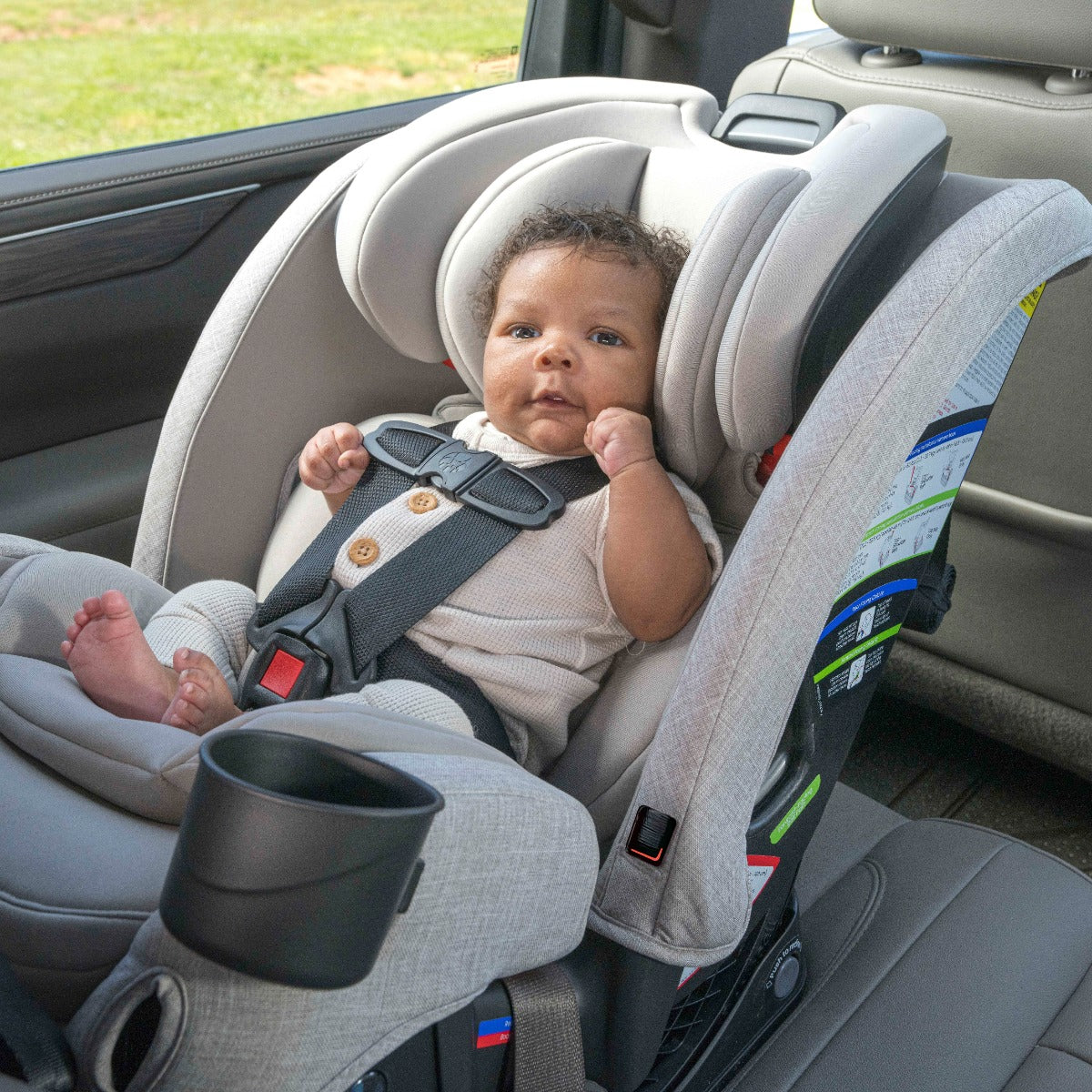Baby sitting in Mineral Grey One4LIfe Car Seat in rear facing position
