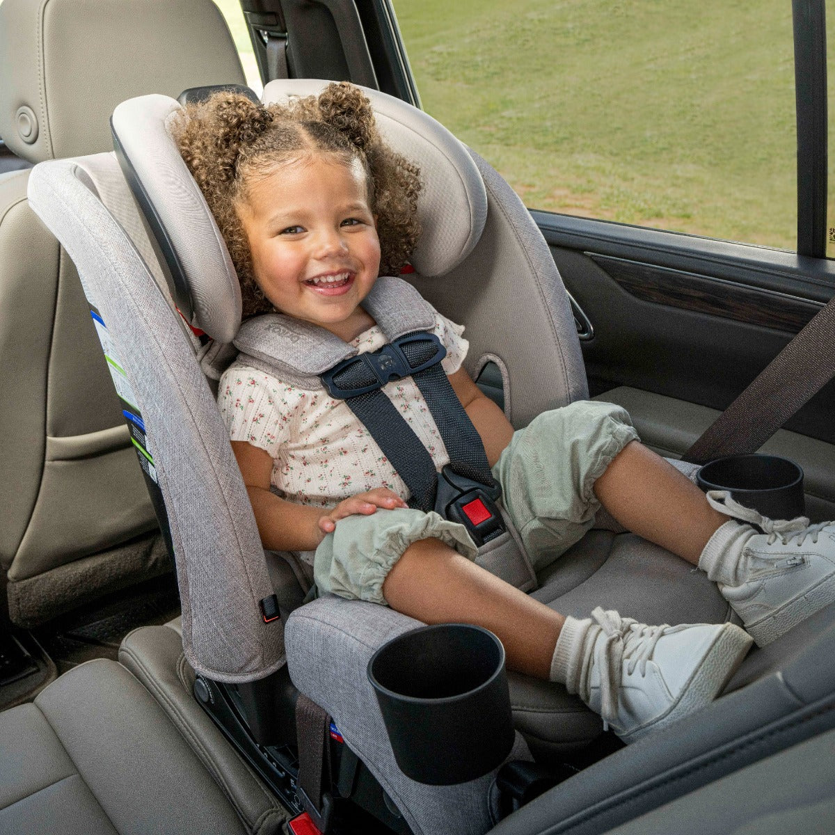 Baby enjoying the car ride sitting in a Mineral Grey One4LIfe Car Seat with rear position