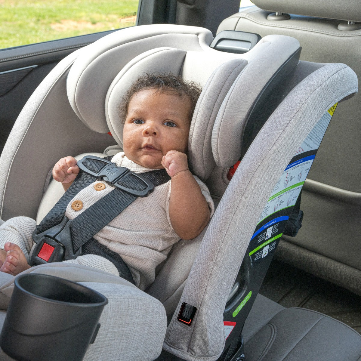 Baby boy in rear position reclined Parchment One4LIfe Car Seat side view