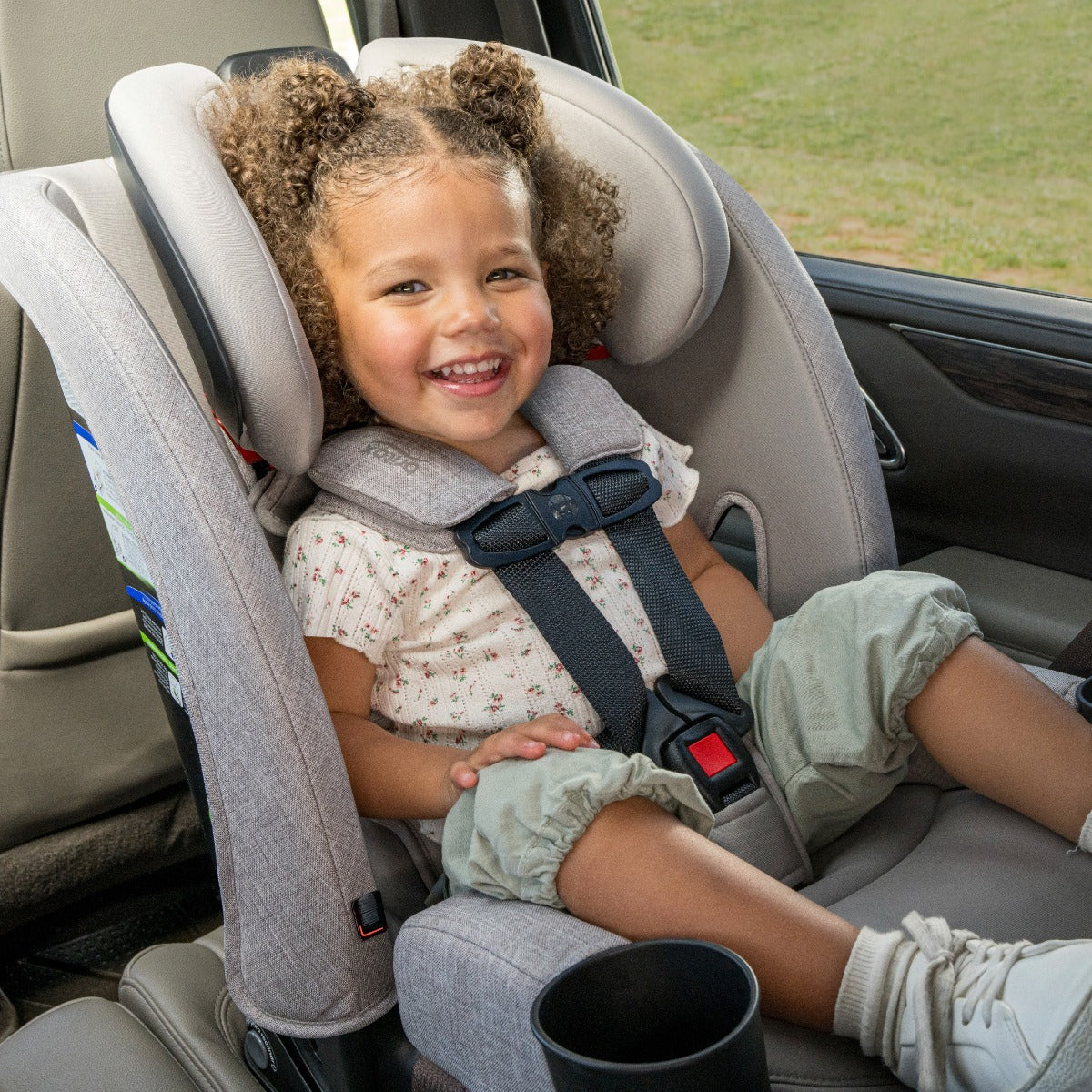 Baby enjoying car ride in Parchment One4LIfe Car Seat side view
