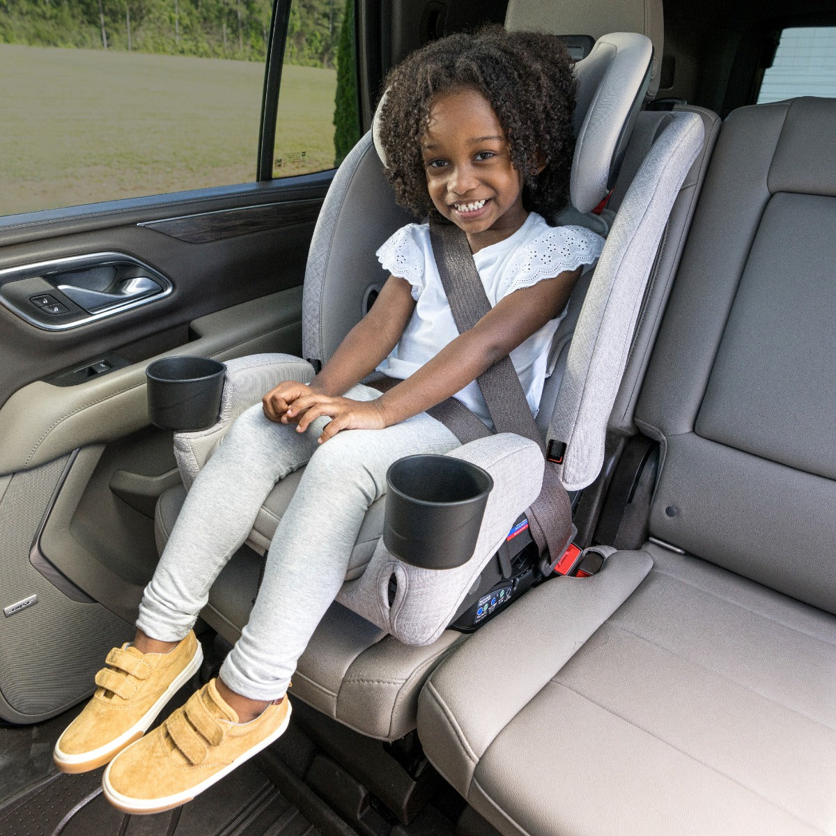 Girl sitting in Parchment One4LIfe Car Seat front view