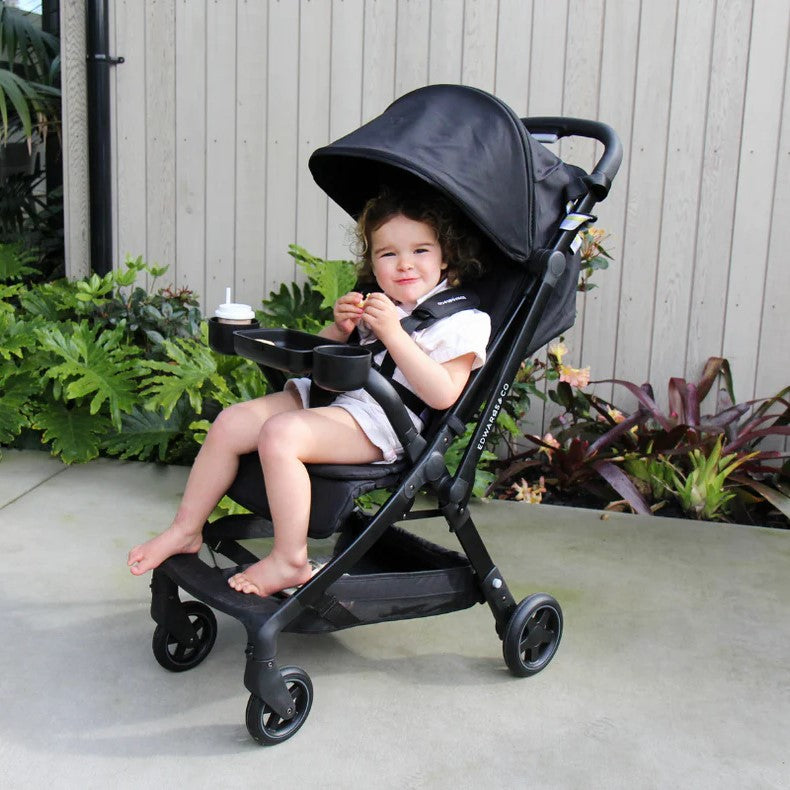 Baby out & About in Lucci pram with snack tray attached 