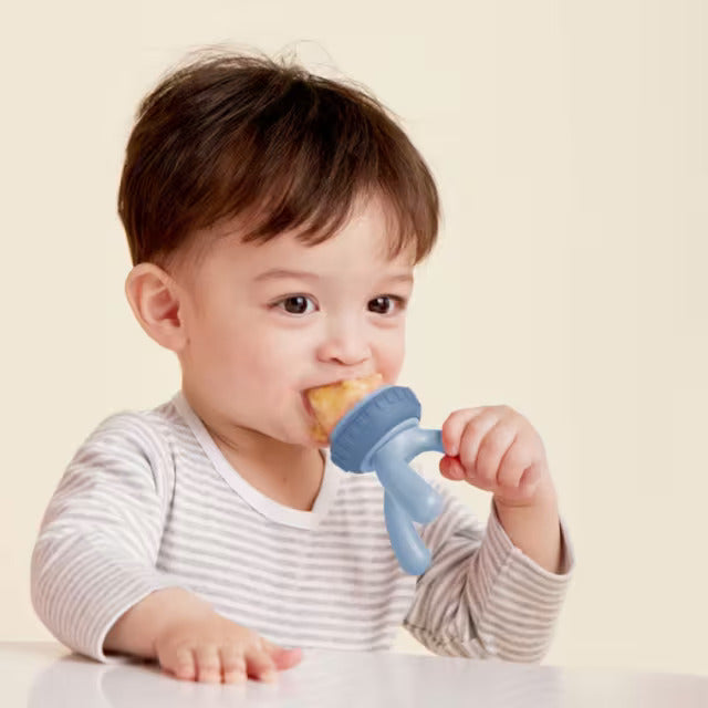 Baby putting Silicone Fresh food feeder in mouth