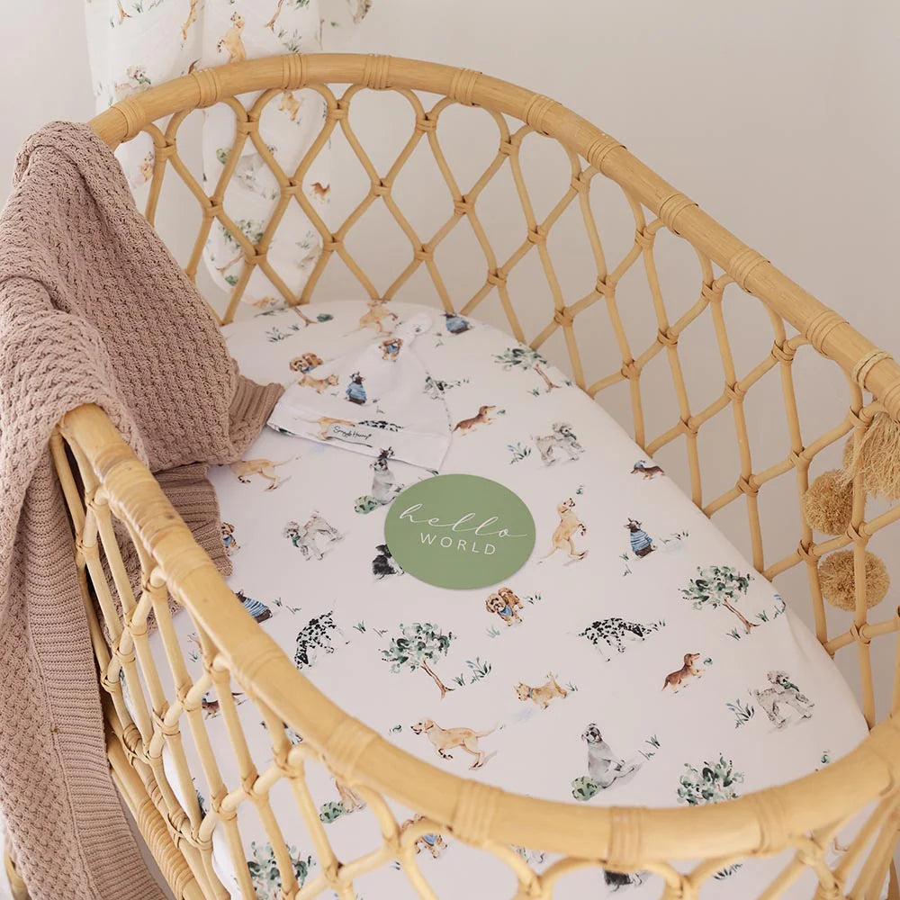 Organic cotton bassinet sheet over mattress in Moses basket