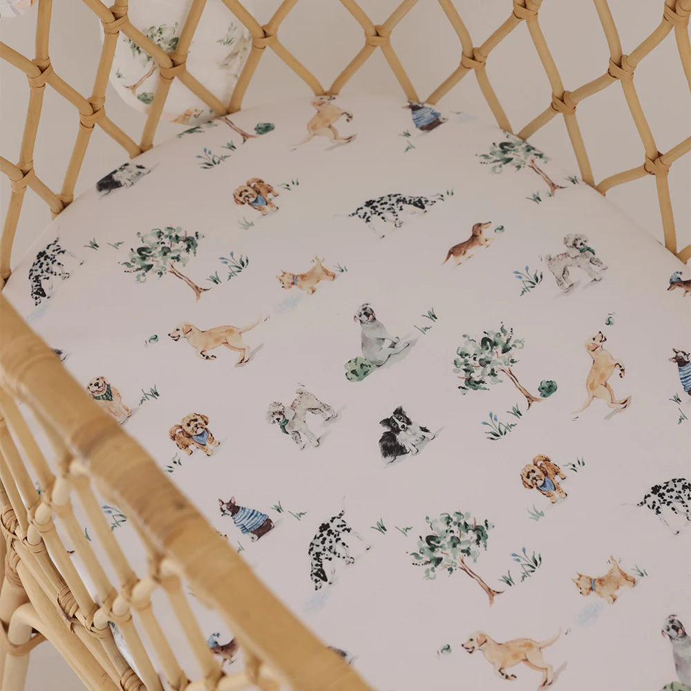 Organic cotton bassinet sheet over mattress in Moses basket