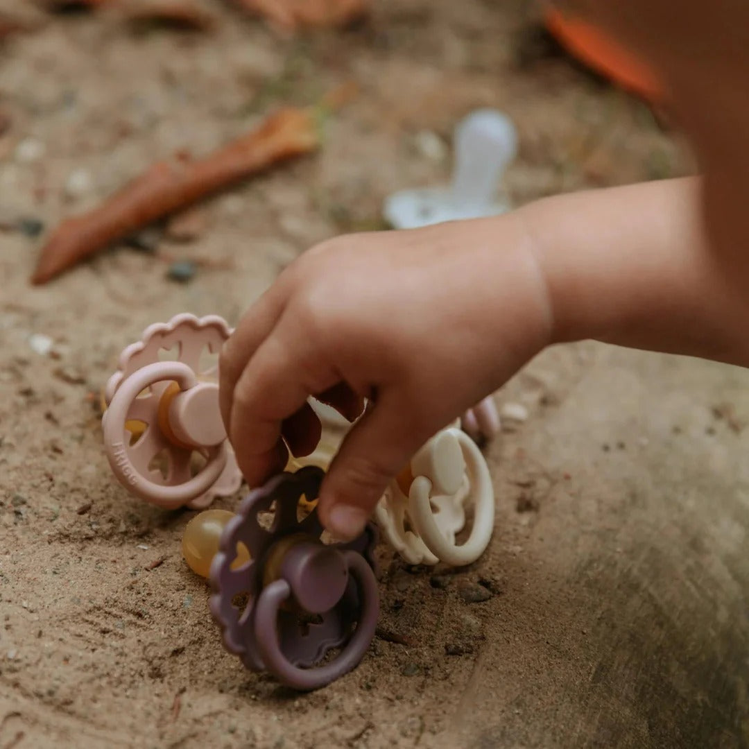 Child picking up fairy tale pacifier
