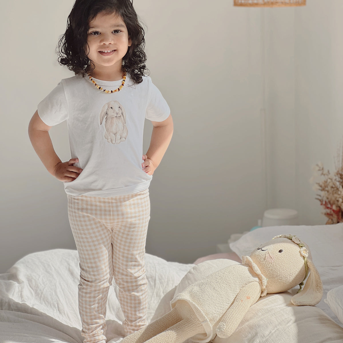 Organic cotton leggings for babies in gingham pattern lifestyle shot 
