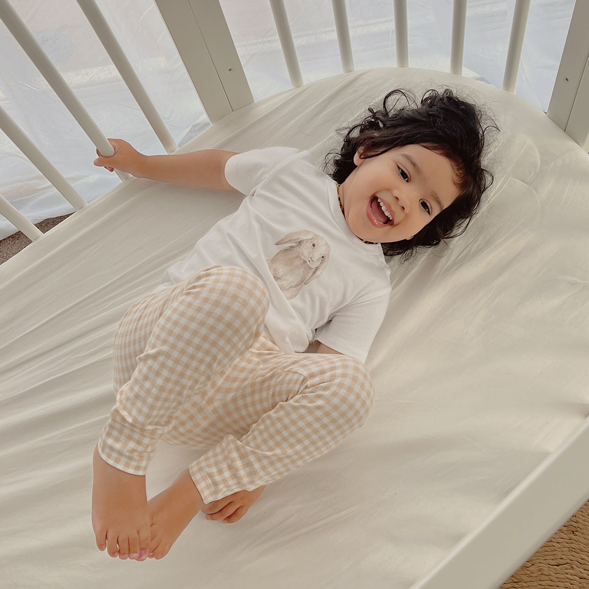 Organic cotton leggings for babies in gingham pattern lifestyle shot 