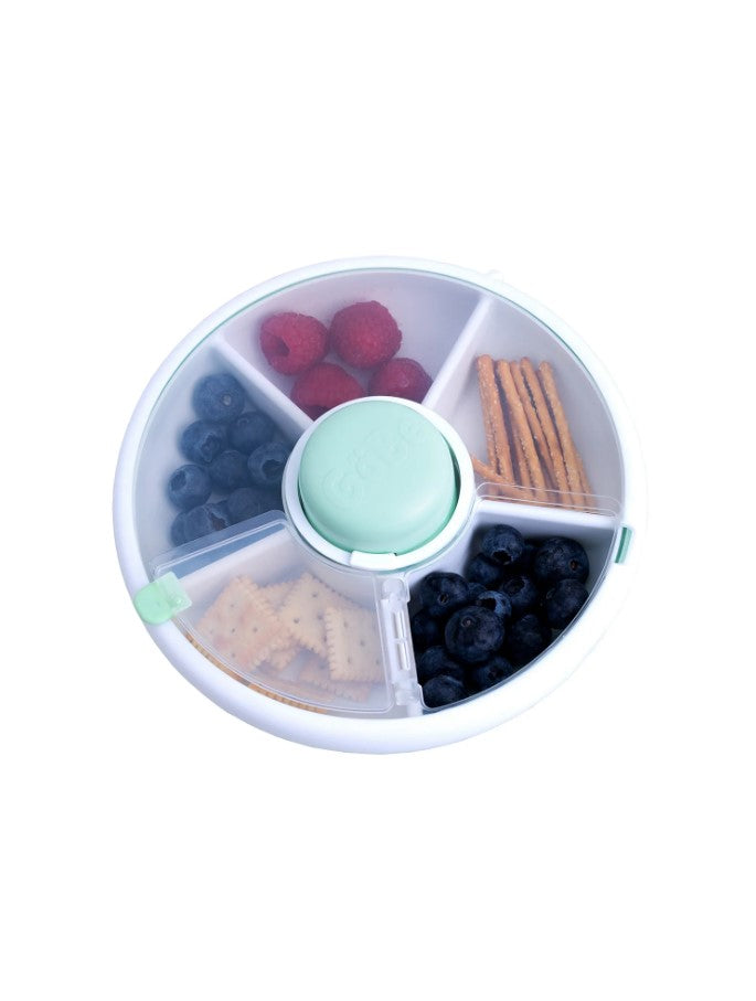 GoBee small snack spinner in teal and white filled with fruits and snacks.