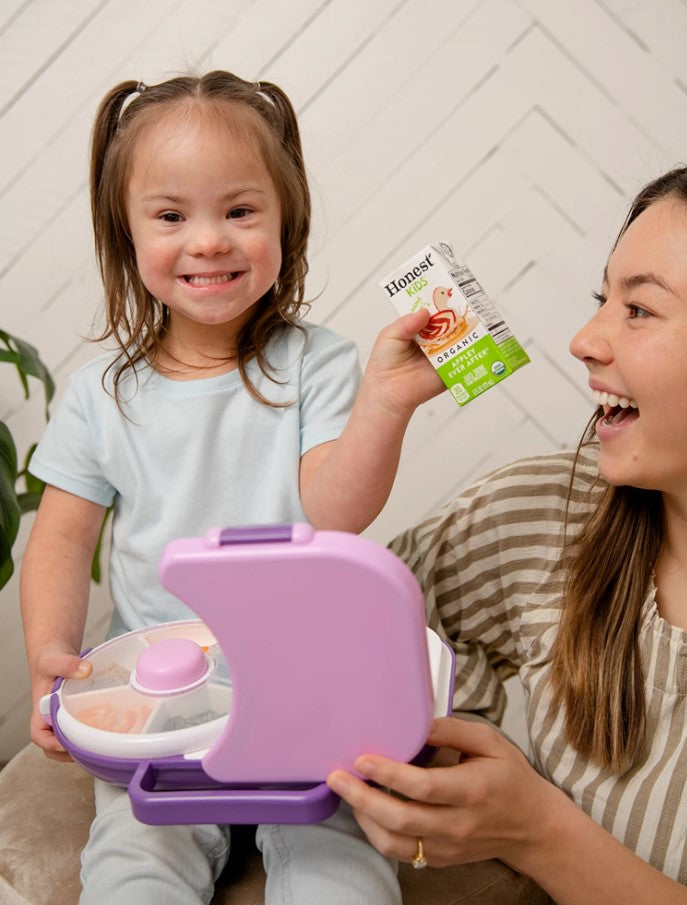 Happy child with GoBe Lunchbox Grape Purple