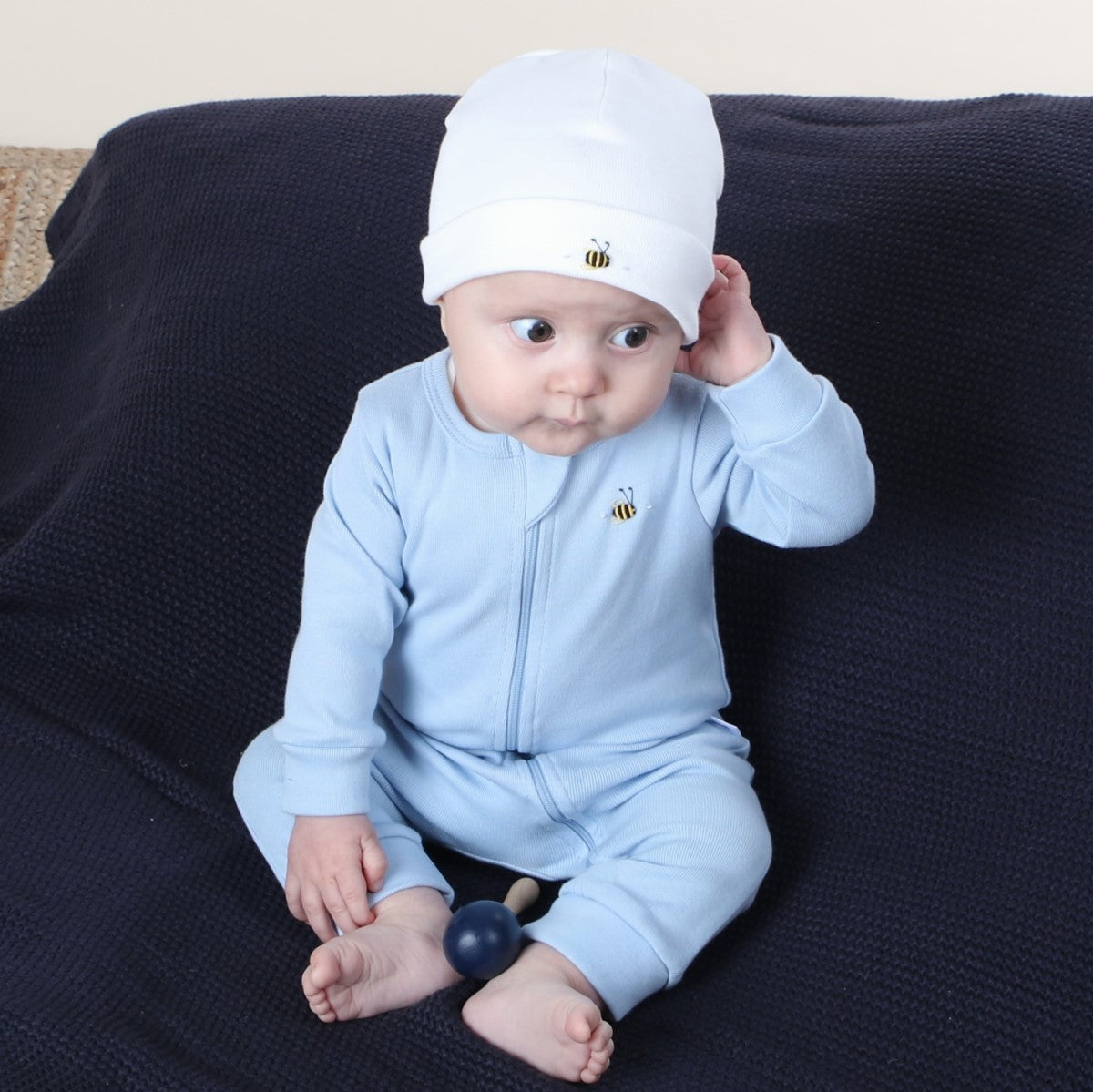 Dimples Baby Clothing cotton zip babygrow in blue on baby