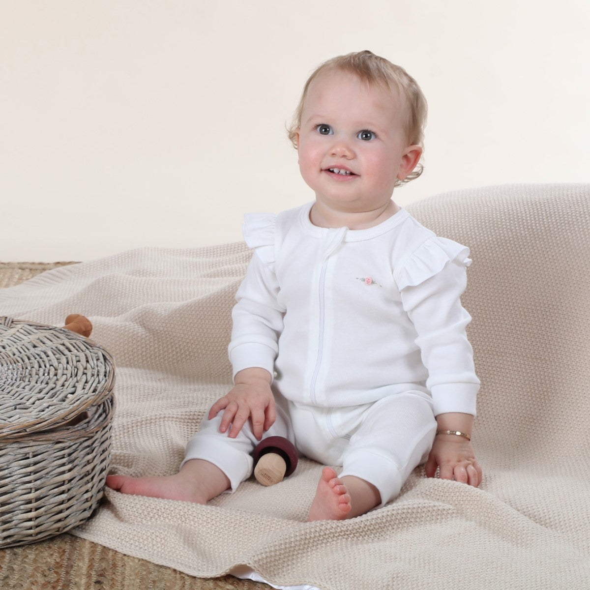 cotton frill zip baby grow in white rose dimples lifestyle shot