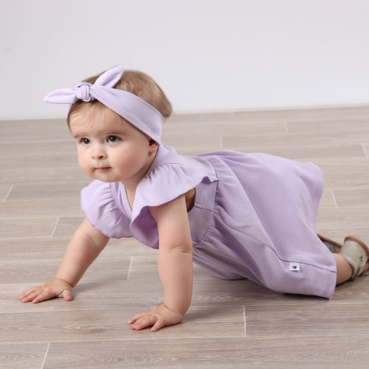 Baby girl crawling wearing Cotton Frill Sleeve Dress in lilac with rose embroidery