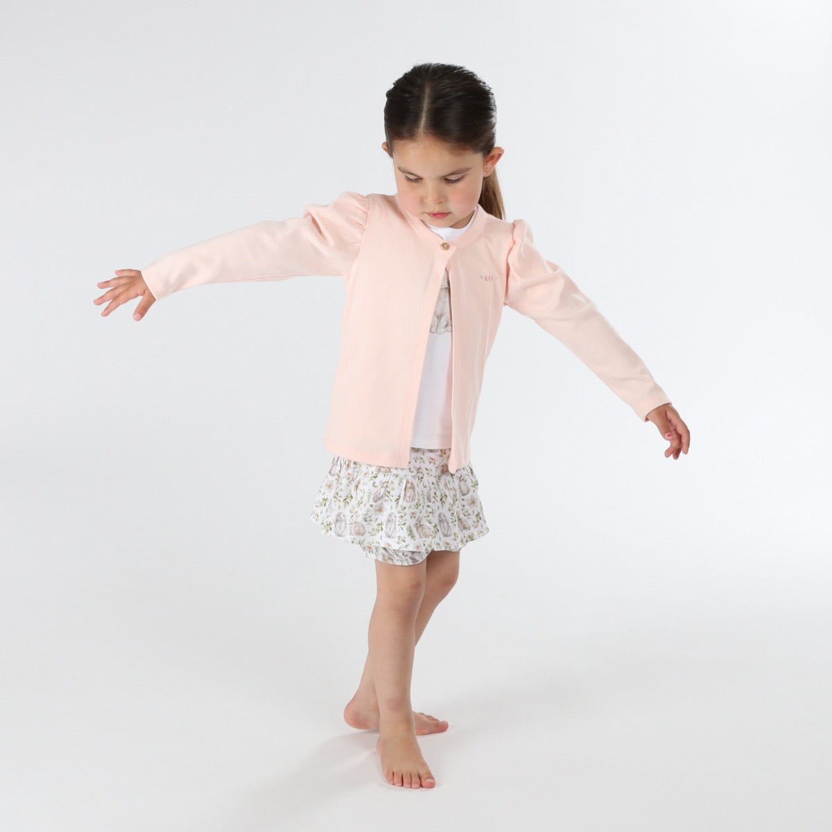 Young girl wearing Dimples Pastel Skies Cotton Puff Cardigan  in Pink