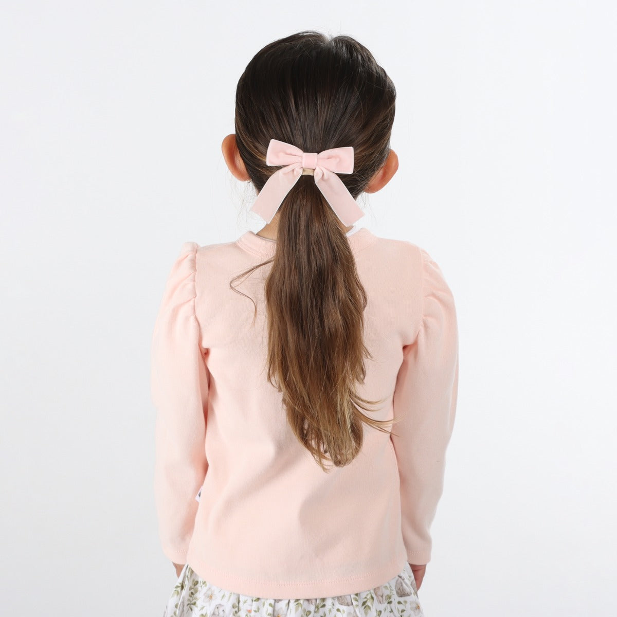 Little girl wearing Dimples Pastel Skies Cotton Puff Cardigan  in Pink back view