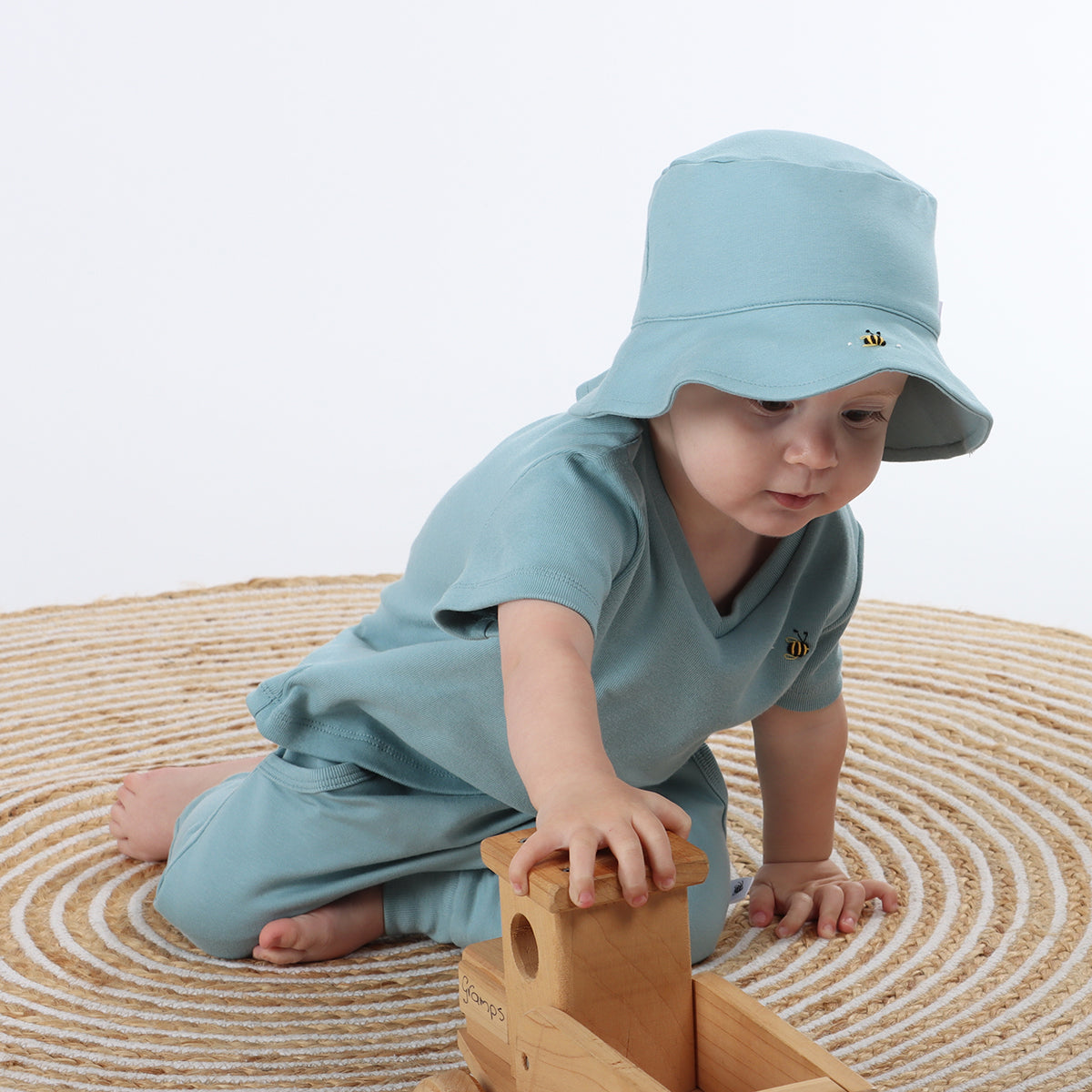 baby playing while wearing Cotton Ocean color boys v-neck tshirt