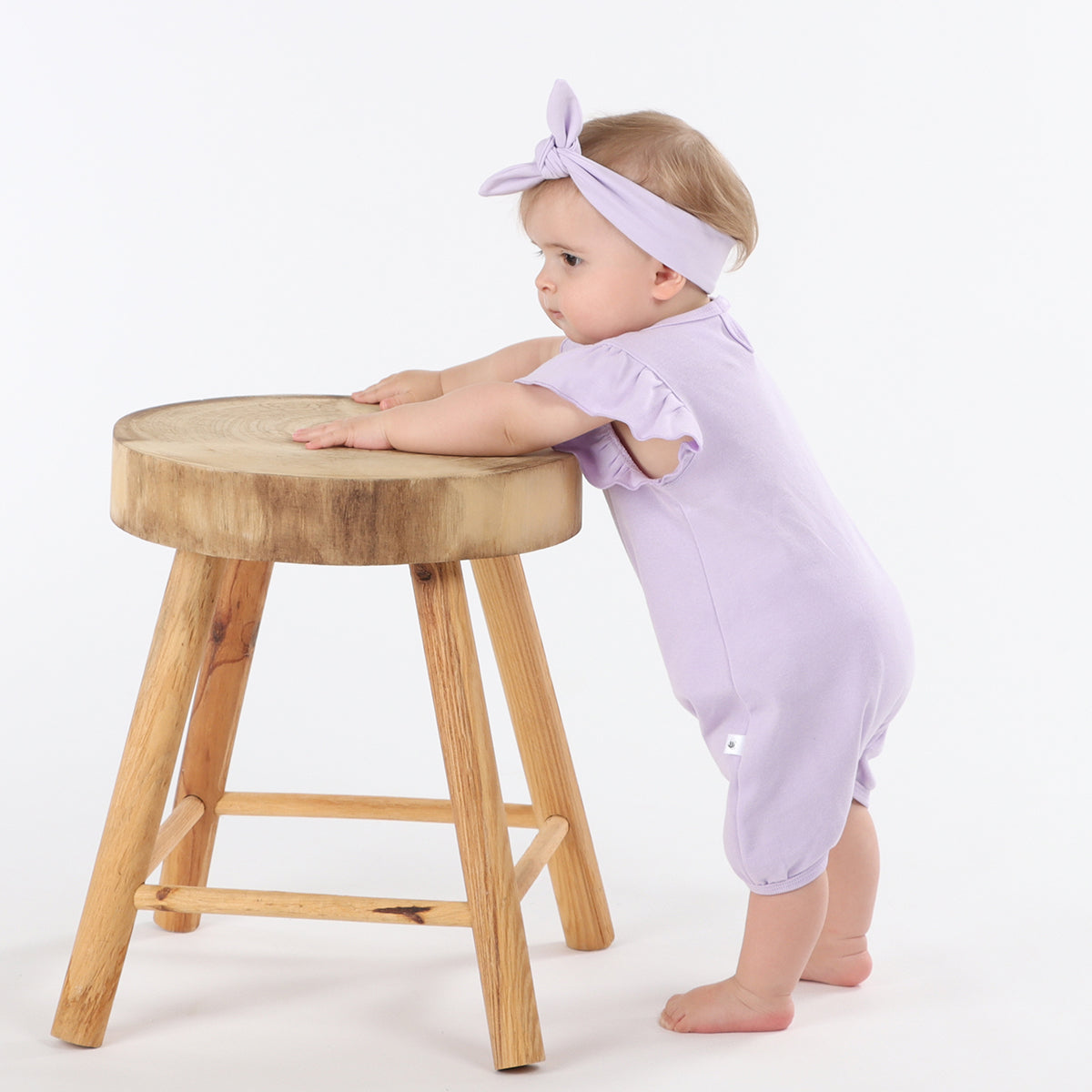 Baby girl wearing Cotton Frill lilac romper with rose embroidery with lilac cotton headband