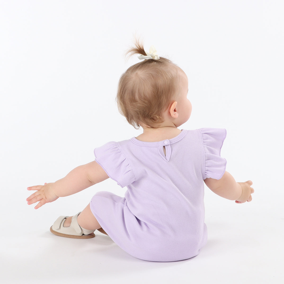 Baby girl playing freely by wearing Cotton Frill lilac romper with rose embroidery