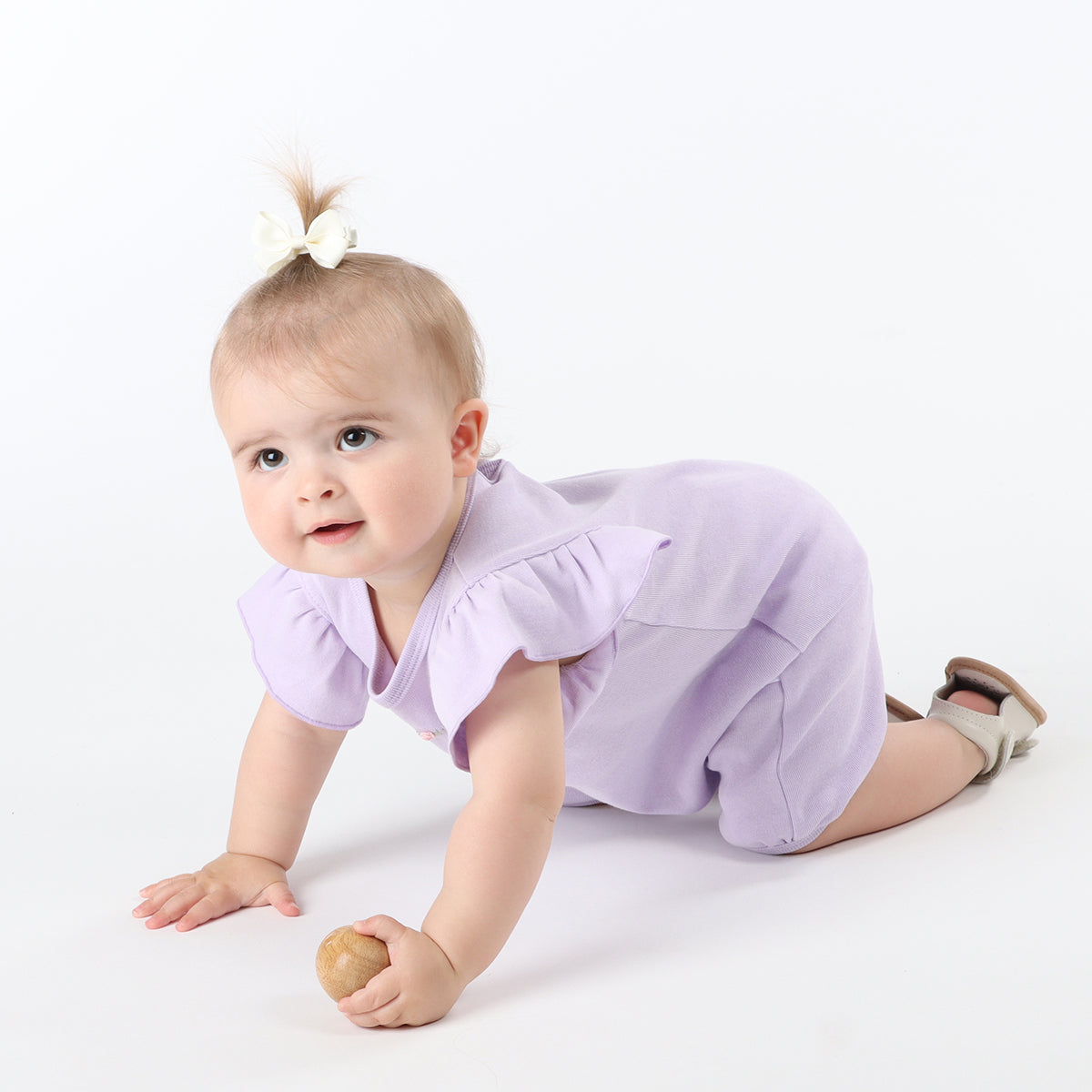 Baby girl playing freely by wearing Cotton Frill lilac romper with rose embroidery
