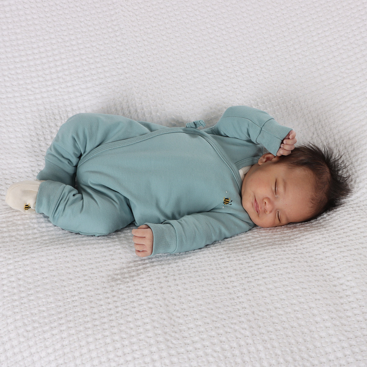 Cotton Tie Baby grow in ocean color with bee embroidery