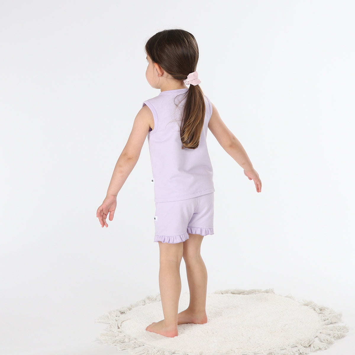 Baby girl wearing lilac frill shorts from Dimples rear facing