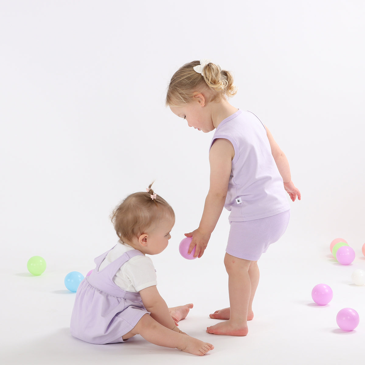 Baby girl wearing cotton lilac bike shorts and singlet from Dimples