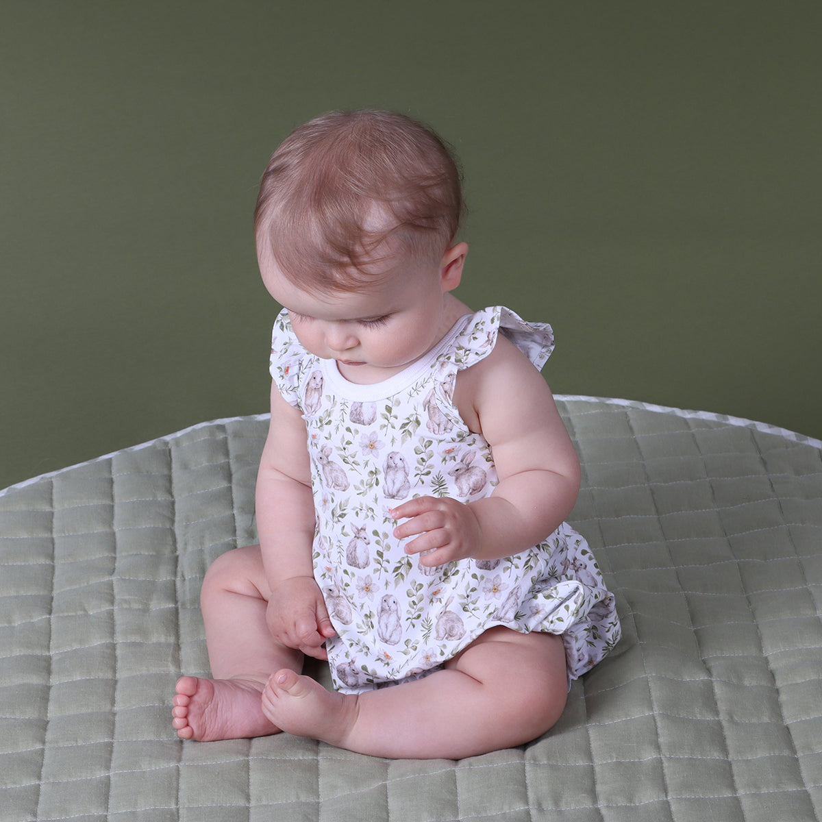Little girl wearing Little Bee Bunny Cotton Romper from the Isabelle & Harper collection