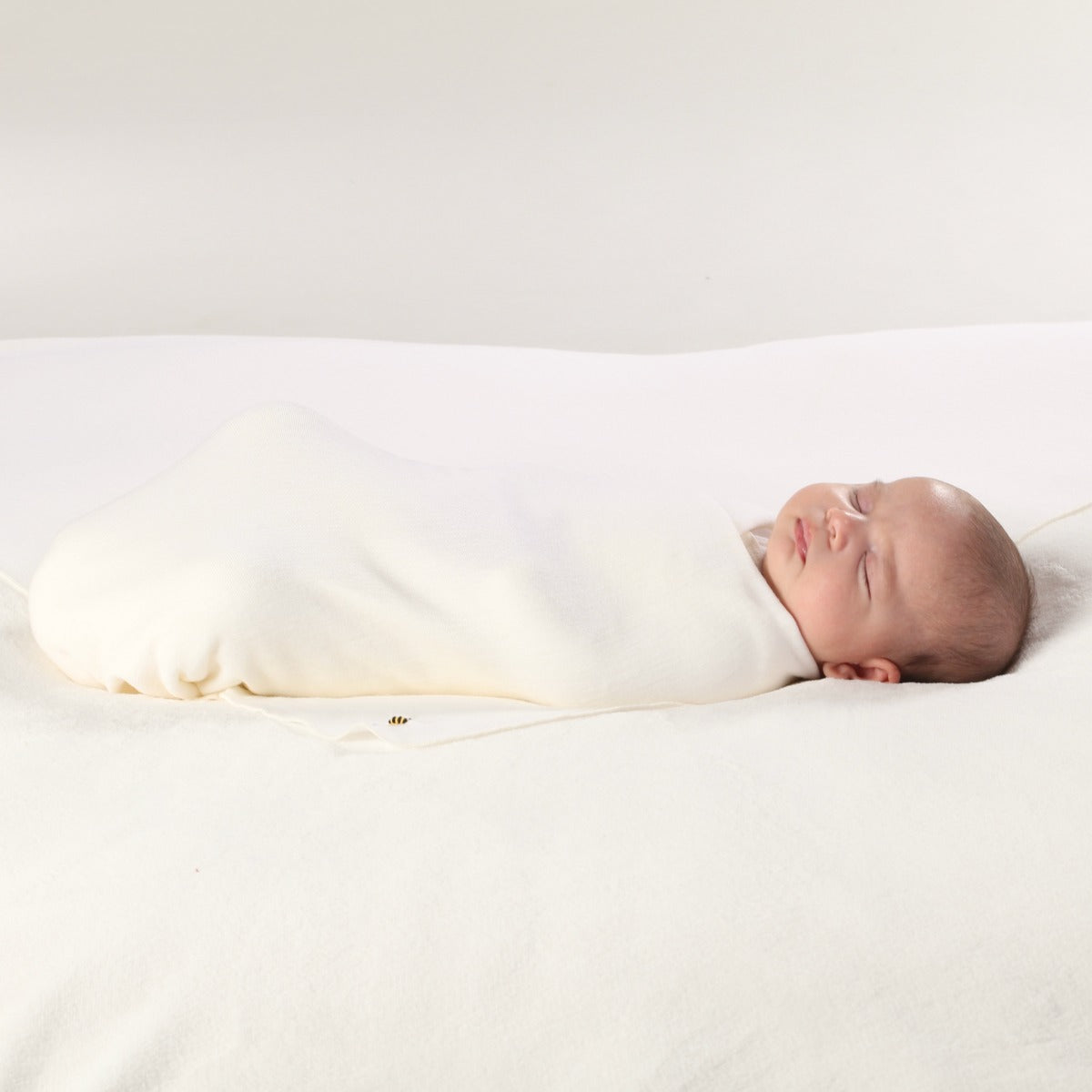 Dimples by Jane Anne Sleep solutions Merino Snugglewrap in Cream Bee