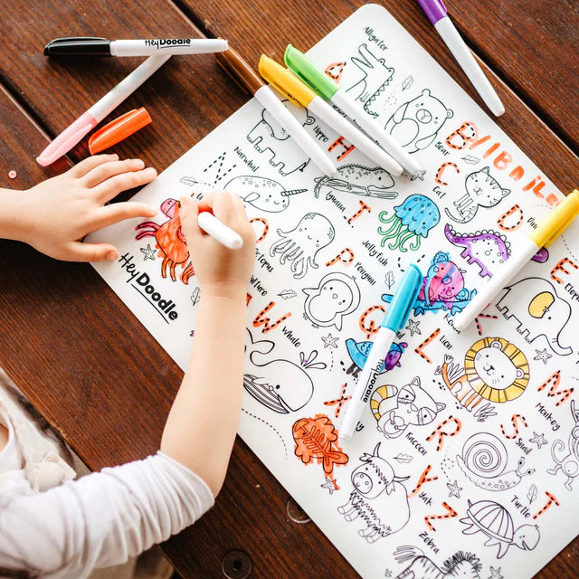 Baby colouring on HeyDoodle silicone reusable colouring mat with letters and animals