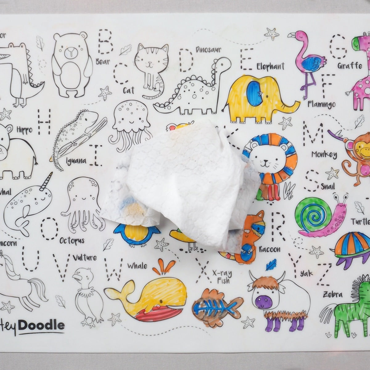 Wipe with damp cloth the HeyDoodle silicone reusable colouring mat with letters and animals