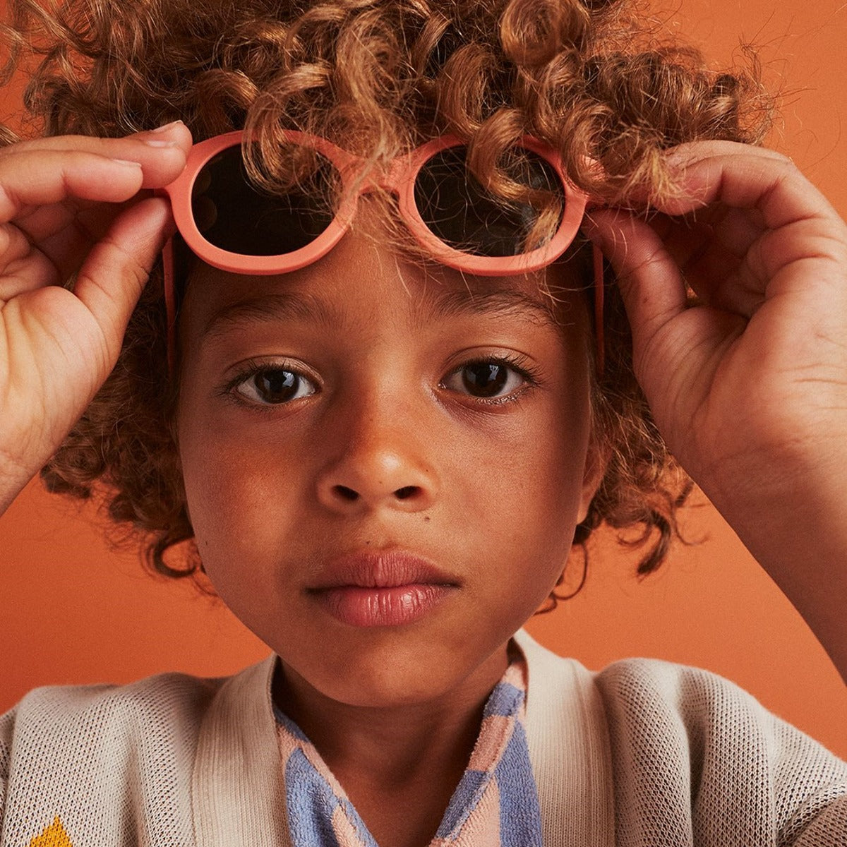 Izipizi kids sunglasses in pastel pink on child