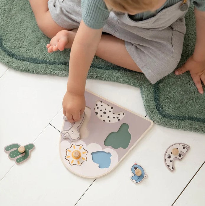 kid playing with Peg Puzzle Lalee Sand
