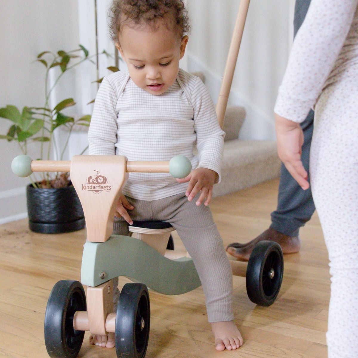 Child Sitting On Kinderfeets Tiny Glider 