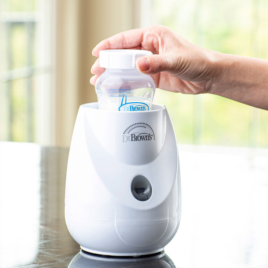 Dr Browns Insta-Feed Bottle Warmer and Steriliser With milk bottle getting sterilise
