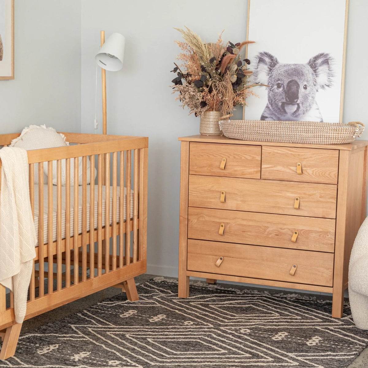 Mackenzie Natural Dresser from Cariboo with cot in a room