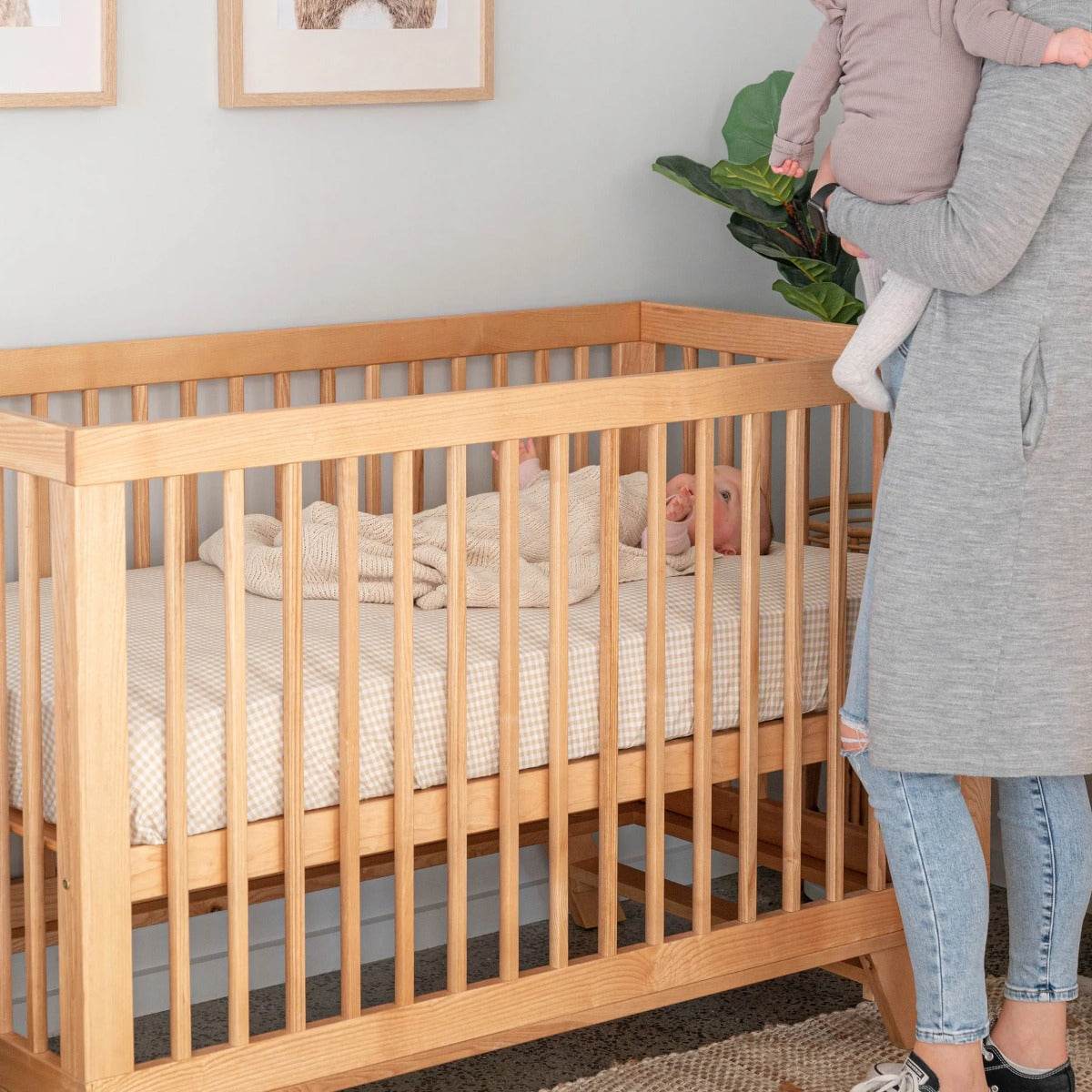 Babu sleeping in Mackenzie Natural Cot from Cariboo in a room 