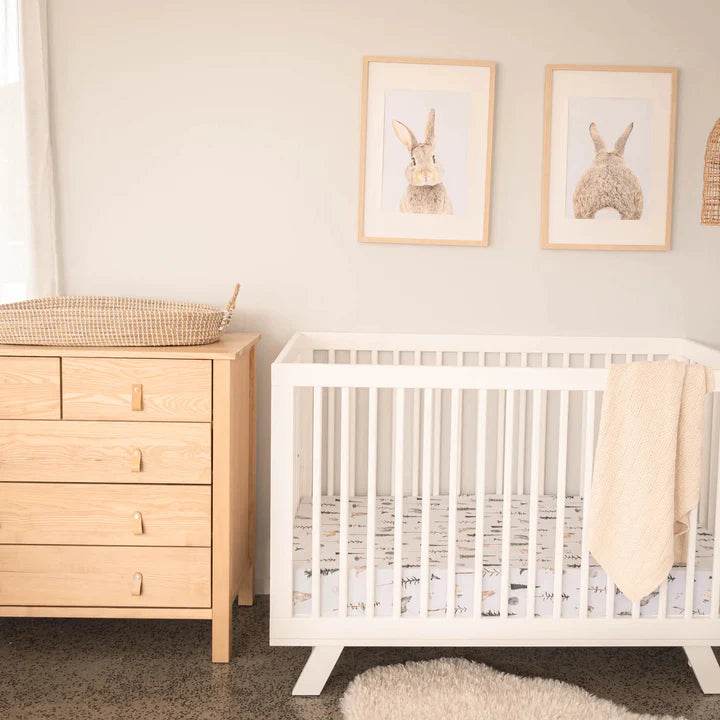 Mackenzie Natural Dresser from Cariboo with cot in a room