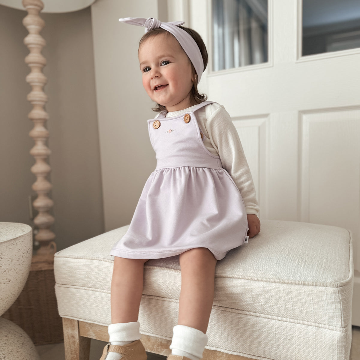 Baby girl wearing Cotton Pinafore dress for girls in lilac with rose embroidery