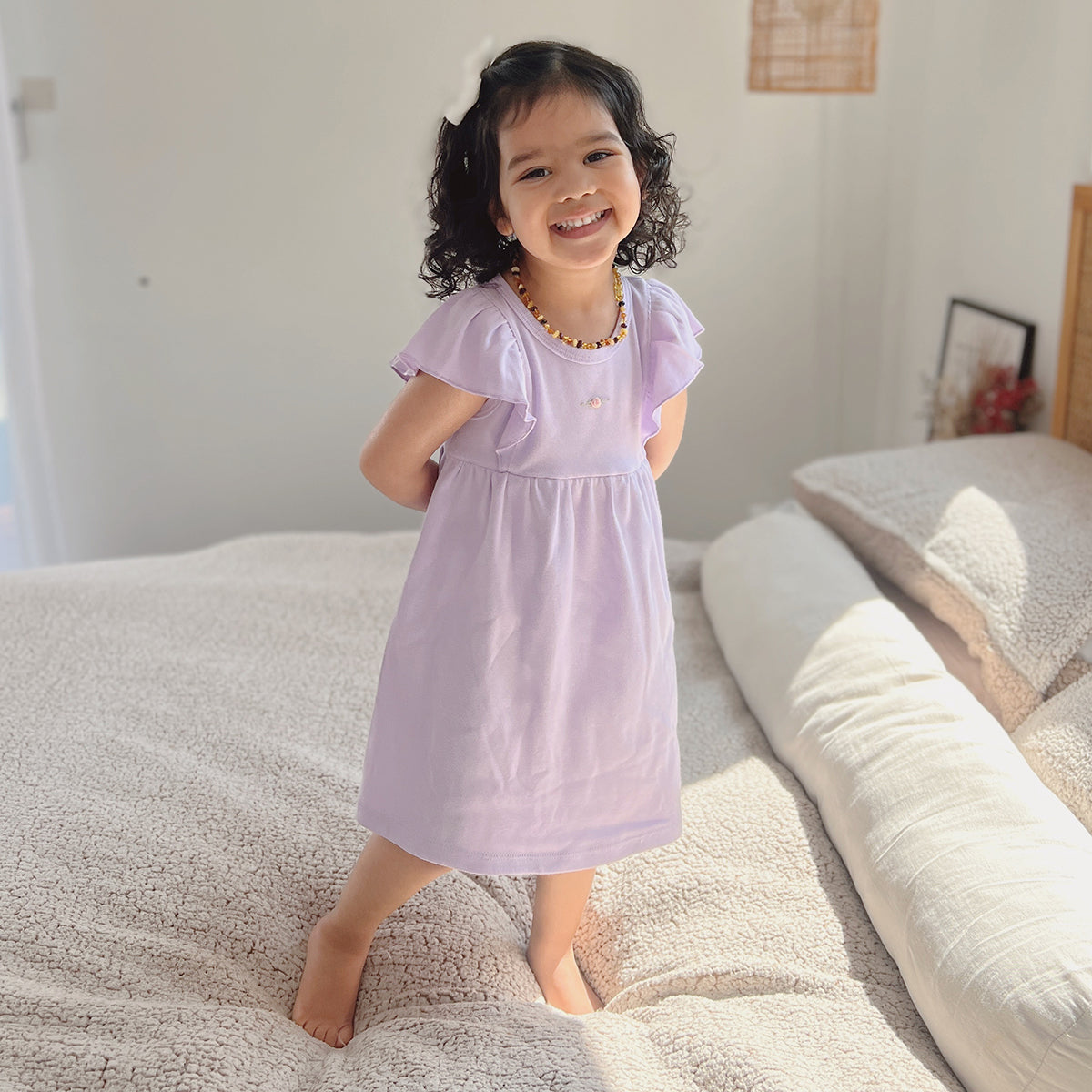 Baby girl wearing Cotton Frill Sleeve Dress in lilac with rose embroidery