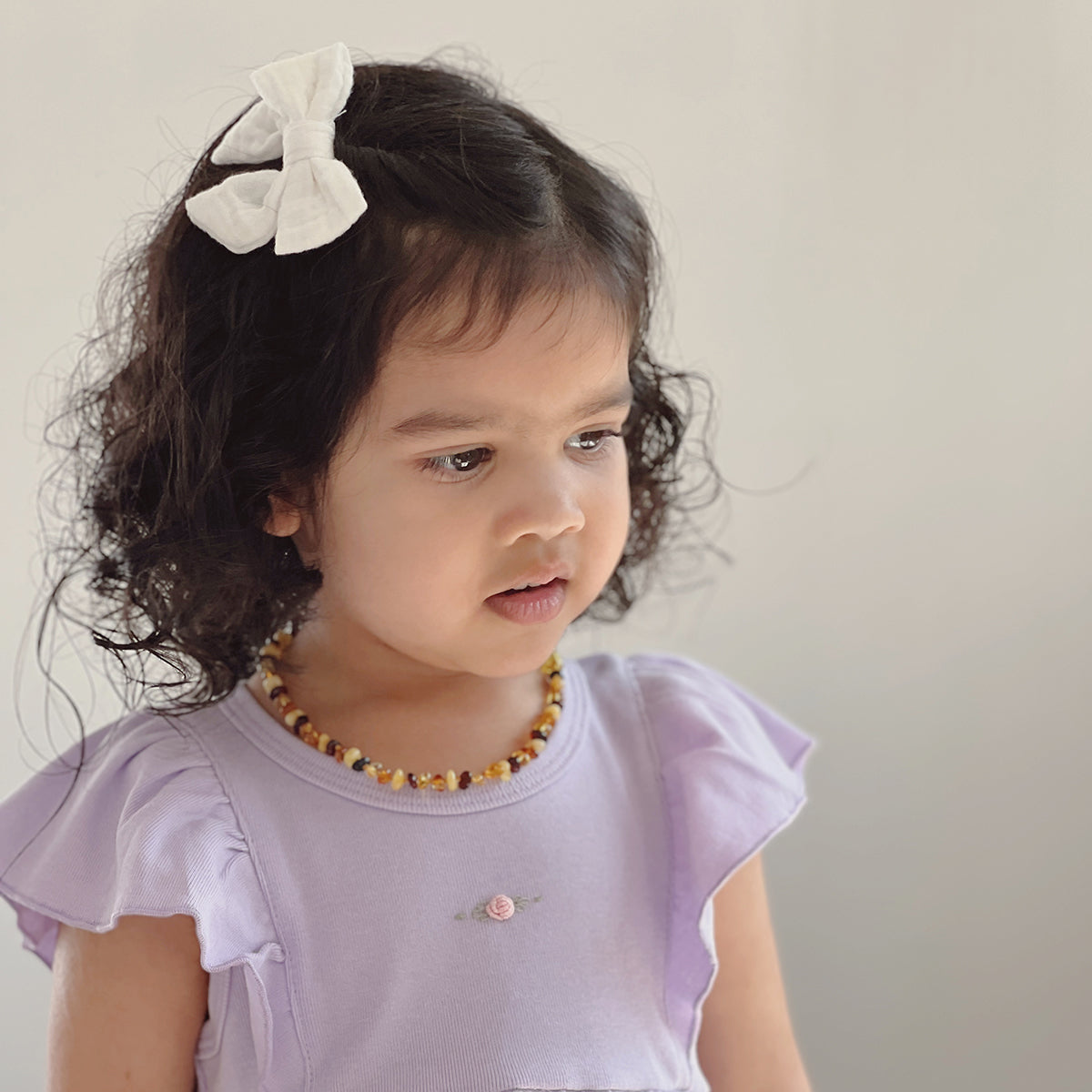 Baby girl wearing Cotton Frill Sleeve Dress in lilac with rose embroidery